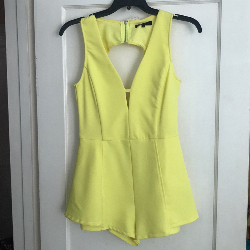 Brand new yellow skort romper. Great condition